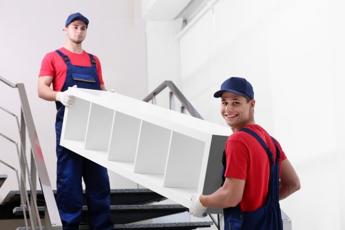 Loading household items into a van for a move in Brent