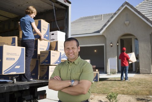 Team member handling furniture with proper moving equipment