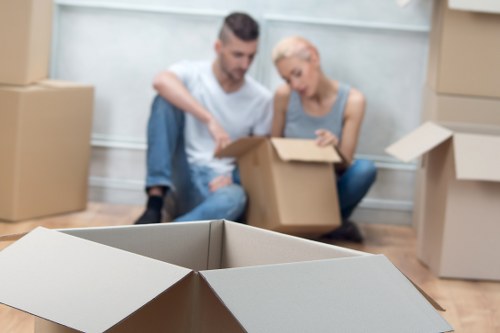 Professional movers loading office items in a Brent commercial area
