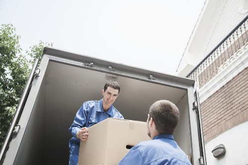 Removal van outside a flat block in a Brent neighbourhood