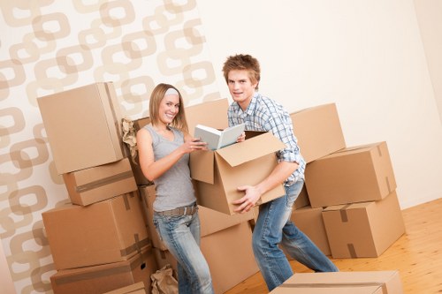 Mover wearing protective gloves and safety footwear