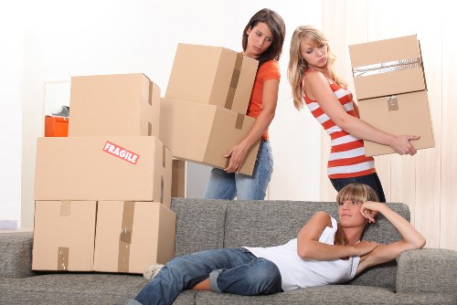 Van removals team transporting boxes and furniture across Brent