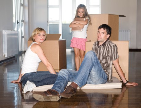 Loading household furniture into a moving van in Brent